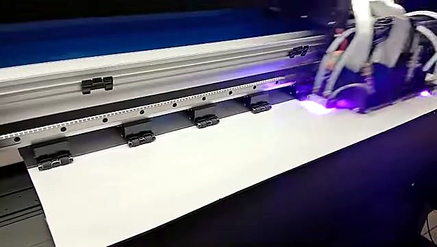 Carriage over white media; black pinch rollers visible (SKU ask)