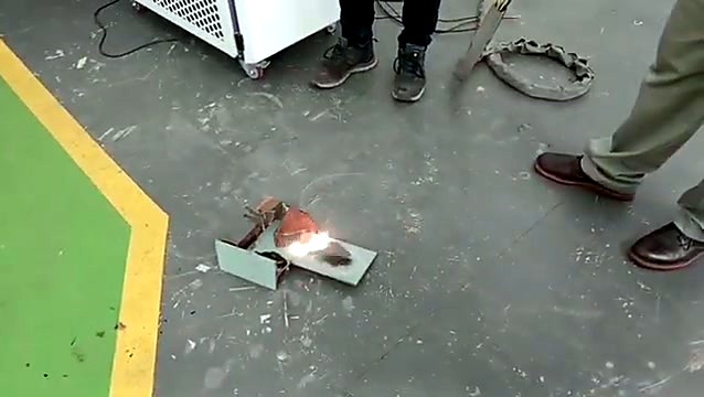 Laser cleaning sparks on a rusty part