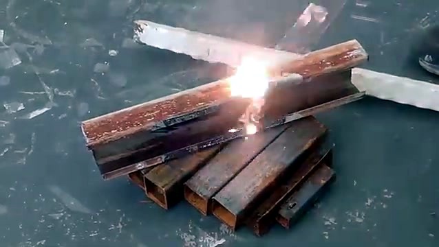 Laser cleaning sparks on a rusty steel box section