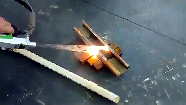 Handheld laser head cleaning stacked steel sections
