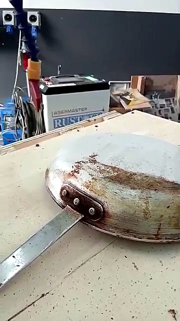 Rusted frying-pan bottom before clean (SKU ask)