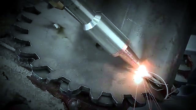 Handheld torch sparks on metal gear weld (family locked)