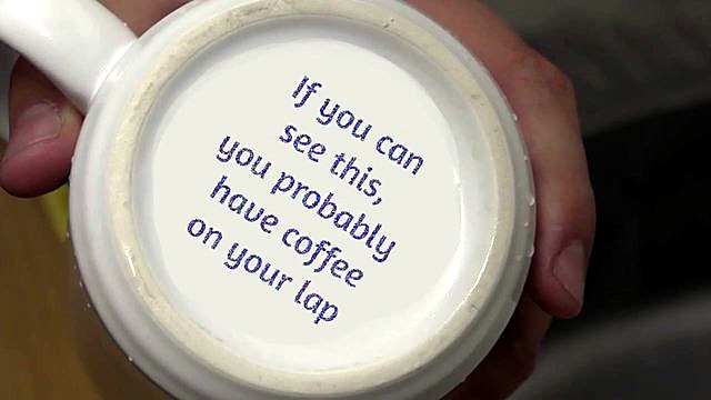 Permanent marked text on ceramic mug base after peel (SKU ask)
