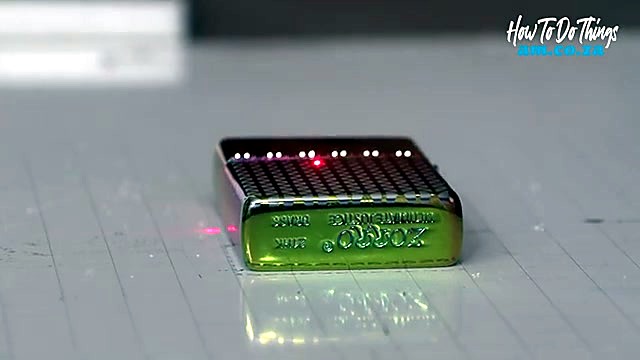 Red pilot marking iridescent Zorro lighter on grid bed (SKU ask)