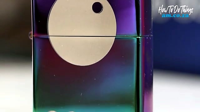 Close finished circular motif on iridescent lighter (SKU ask)