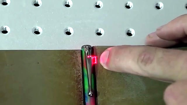 Red frame square on iridescent pen clip jig (SKU ask)