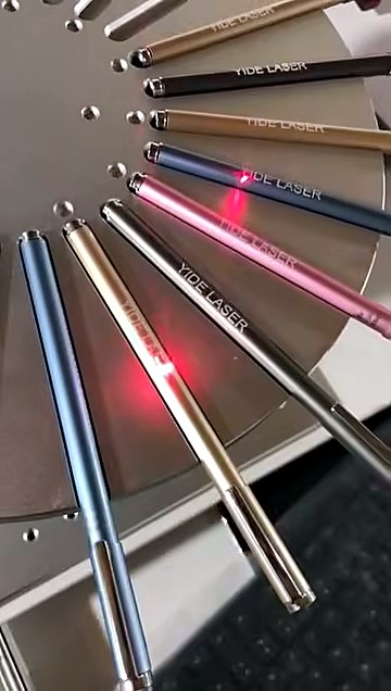 Radial pens with sample engraved text on rotary fixture (SKU ask)