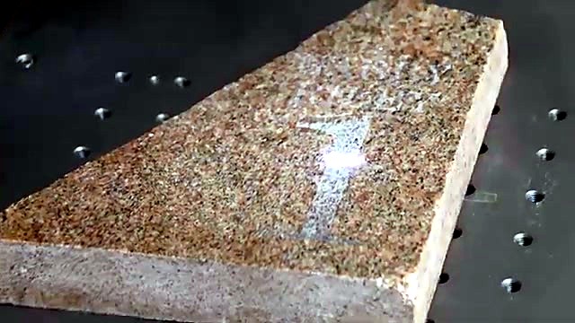 UV laser engraving numeral into granite (SKU ask)
