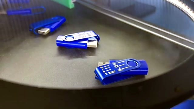 Marked blue USB drives close on belt (SKU ask)