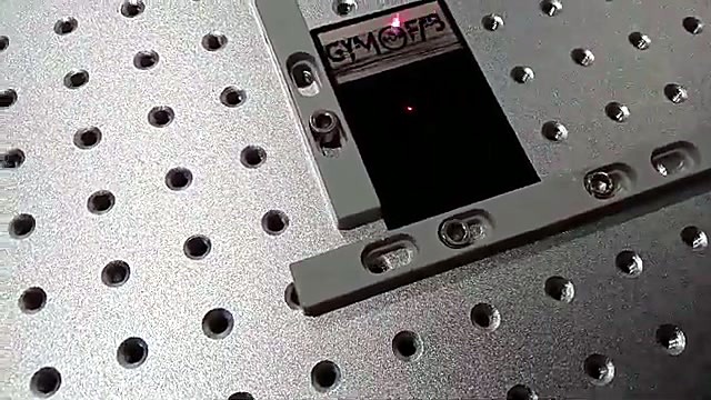 Black GYM plate in L-jig on grid bed (SKU ask)