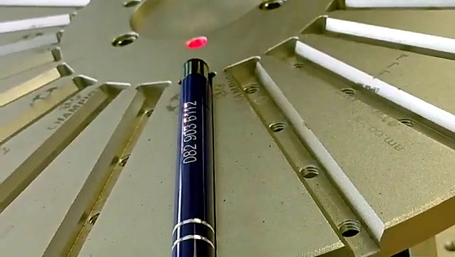 Laser-marked number on painted pen