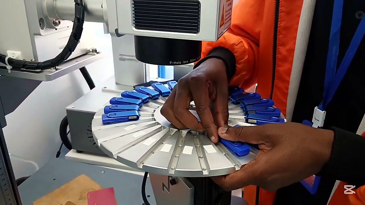 Loading blue USBs into rotary indexing jig (SKU ask)