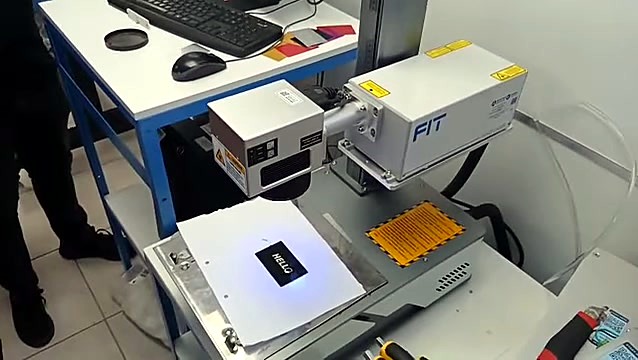 FIT-marked head marking HELLO on black card (SKU ask)