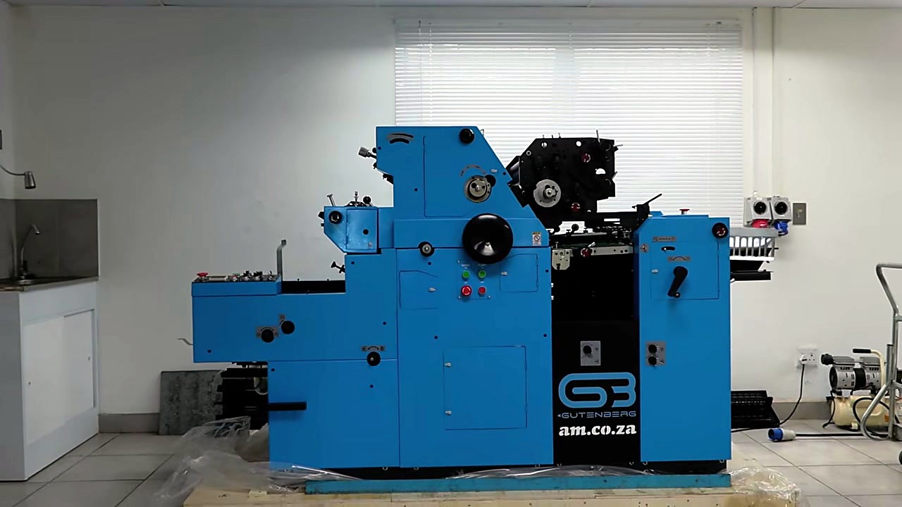 Wide: GUTENBERG + am.co.za panel on blue offset press (SKU ask)