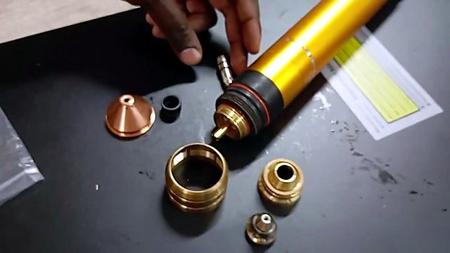 Knolled torch consumables beside gold body (SKU ask)