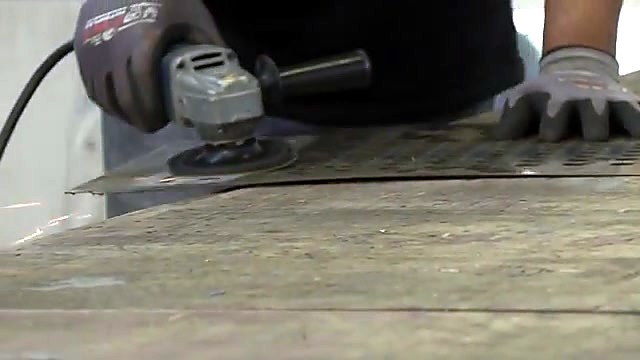 Handheld grind finish on cut stainless edge (SKU ask)