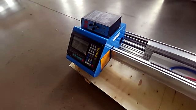 Blue control unit on aluminium rail atop shipping crate (SKU ask)