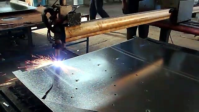 Gantry torch cutting with sparks over galvanised (SKU ask)