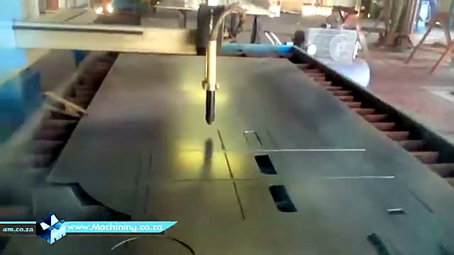 Blue gantry over plate with cut shapes (SKU ask)