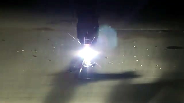 Gantry plasma torch close-up over steel plate (SKU ask)