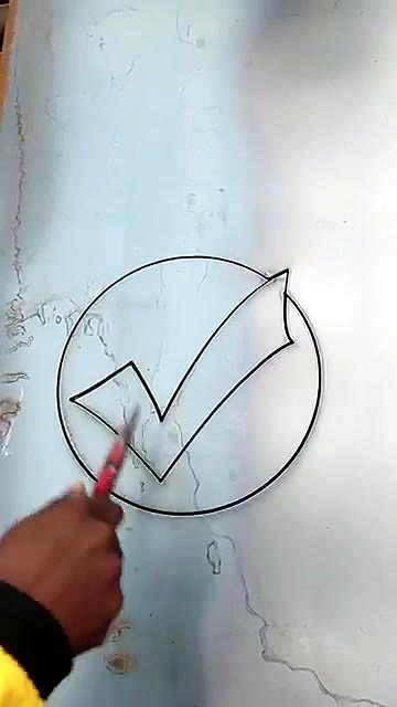 Hand pointing at finished WellDone tick cutout (SKU ask)