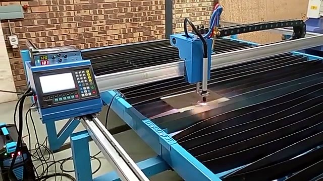 Plasma torch cutting on slat bed with sparks (SKU ask)