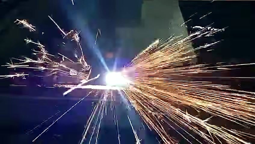 Thermal cut spark shower on steel plate (SKU ask; title plasma)
