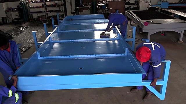 Multiple blue water basins lined in workshop (SKU ask)