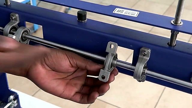Silver rod in pillow blocks on blue crossbar adjust (SKU ask)