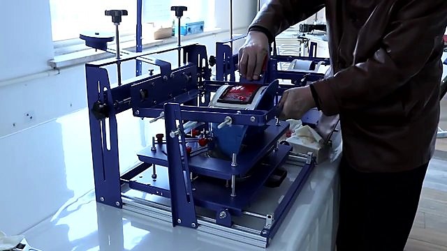 Assembled blue press + squeegee on curved print (SKU ask)