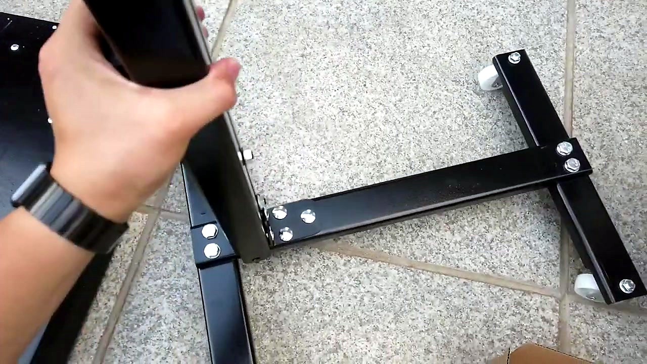 Black caster tripod base during assemble (SKU ask)
