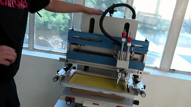 Hands adjusting automatic flat screen press (SKU ask)