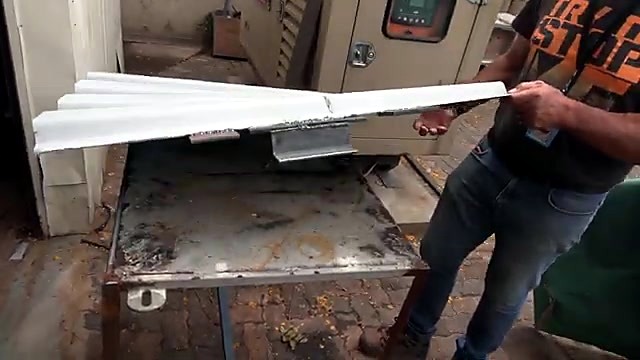 Finished corrugated piece with welded bracket (SKU ask)