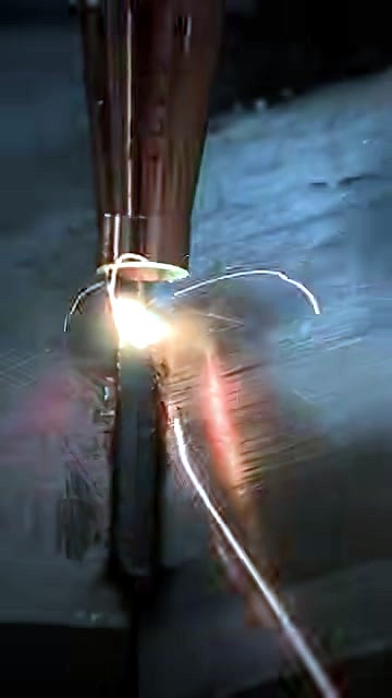 Copper nozzle welding metal seam with filler wire + sparks (SKU ask)