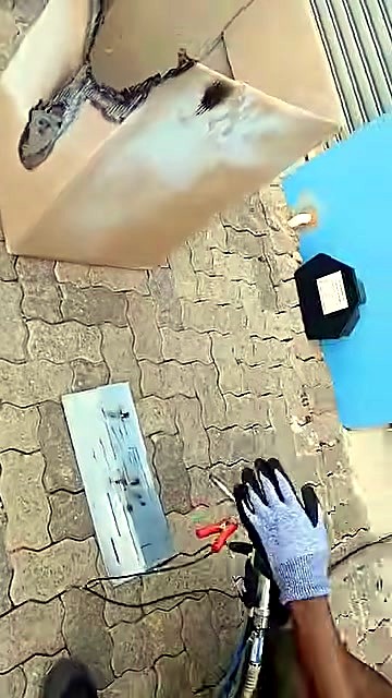 Close process: gloved hands + torch on clamped metal (SKU ask)