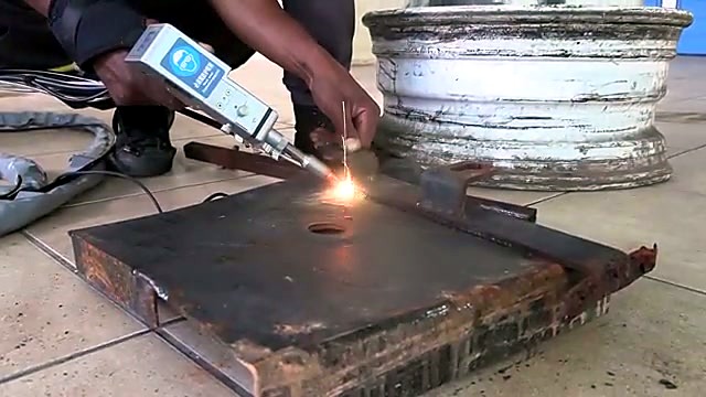 Handheld clean on rusty plate — Dedicated/Versatile process (taxonomy)