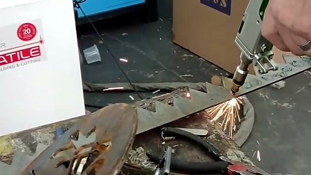 Handheld laser cutting steel with sparks
