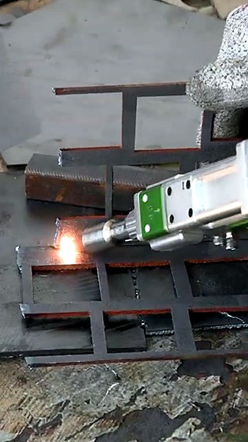 Handheld gun over metal lattice (family locked)
