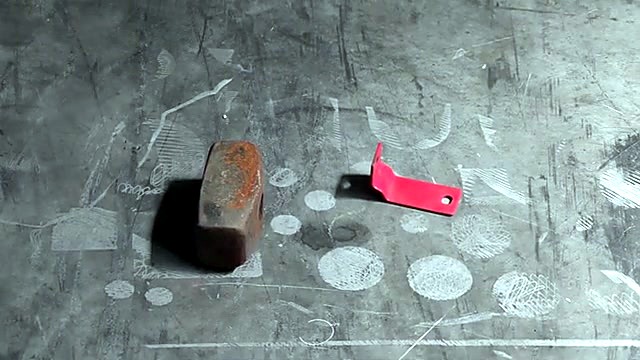 Rusty hammer head + bracket targets on floor (SKU ask)