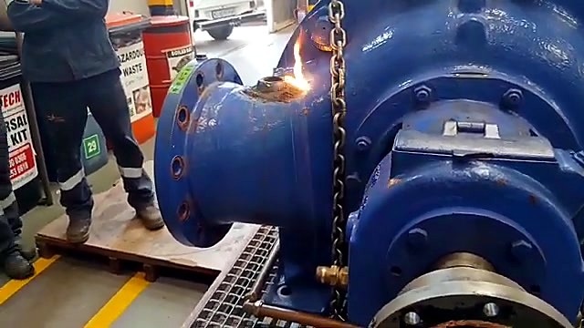 Bright cleaning sparks on bolted blue flange (SKU ask)