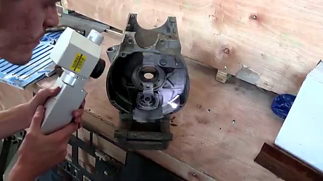 Operator two-hand hold on pallet casting (SKU ask)