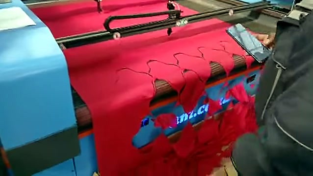 am.co.za blue chassis; red fabric cutouts on conveyor (SKU ask)