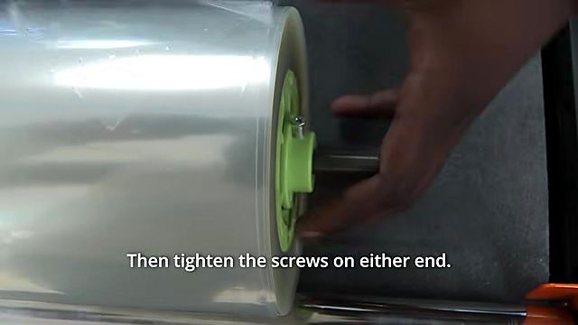 Tighten set screws on lime-green core flange (SKU ask roll)