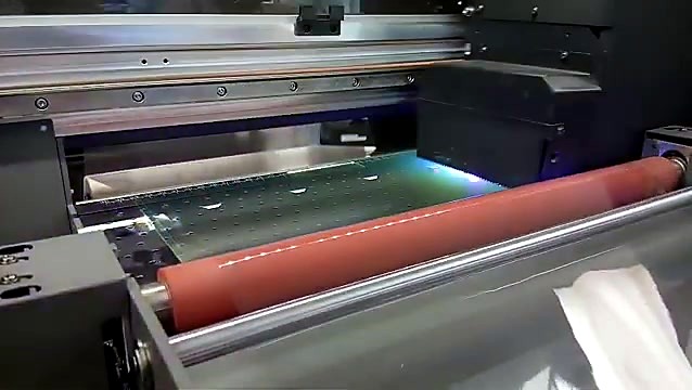 UV-DTF carriage with UV LED over clear adhesive film