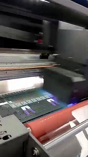 UV carriage over film with laminator roller