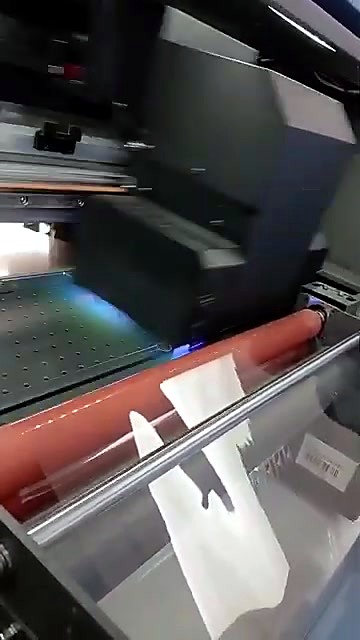 Laminated stickers exiting the built-in laminator