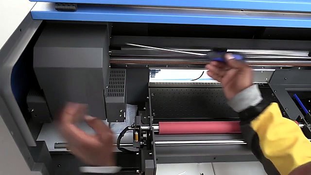 Blue UVDTF chassis + pink roller during carriage service (SKU ask)