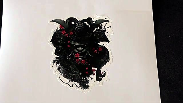 Detailed UV-DTF dragon/mask graphic on film (SKU ask)