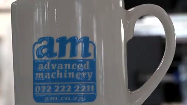 Applied sticker on mug with am advanced machinery contact (SKU ask)