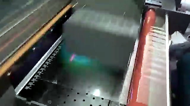 Orange/red exit roller + film path (SKU ask)